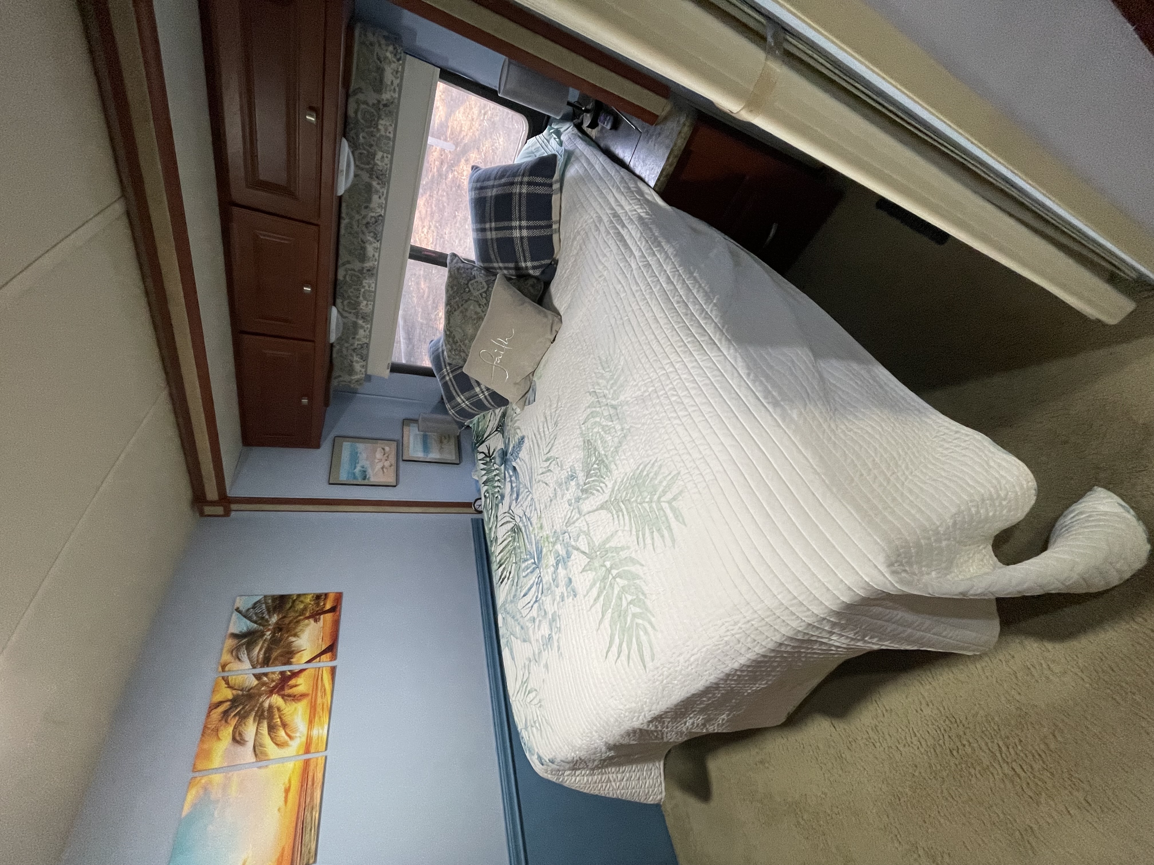 Bedroom with walk-around queen bed